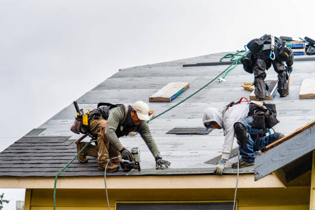 Professional Roofing technician working in New Town, MA